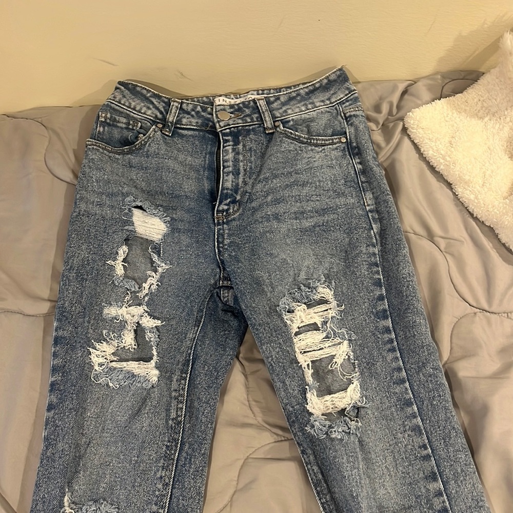 blue ripped jeans